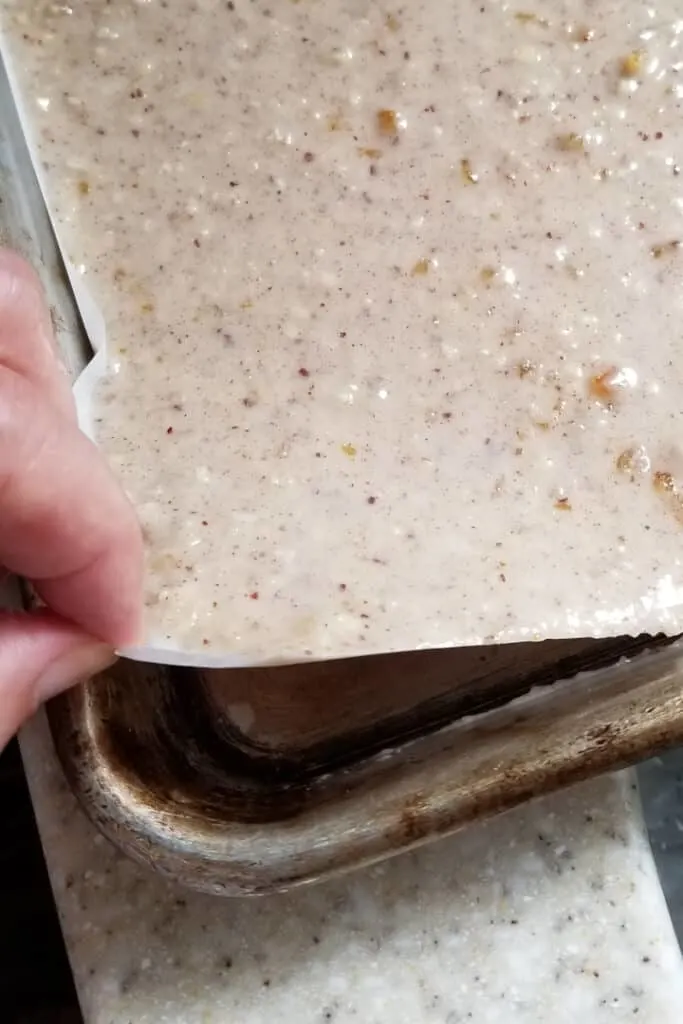 a photos showing that lebkuchen batter is spread to just 1/4 inch thick