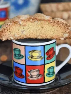 a sourdough biscotti on a coffee cup