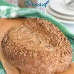 a pinterest image for sourdough cracked wheat bread with text overlay