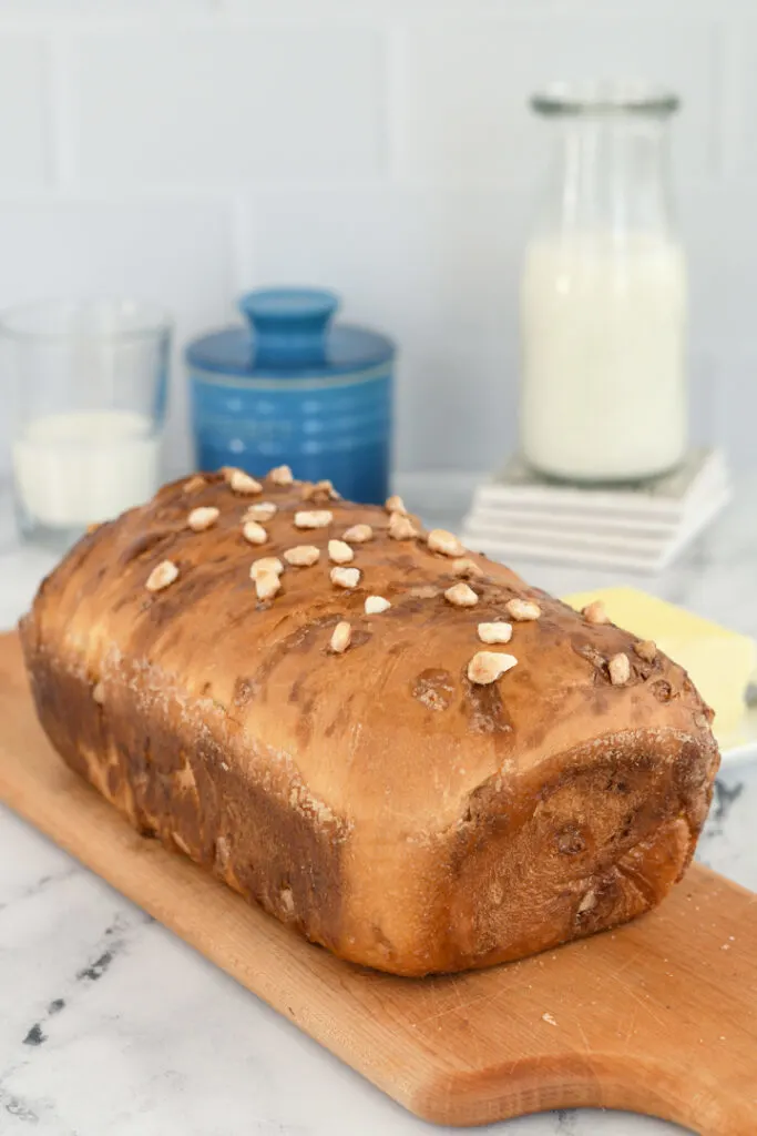 a loaf of dutch sugar bread on a cutting board