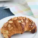 a pinterest image for homemade almond croissants with text overlay