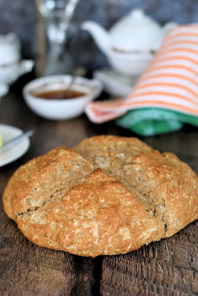 a loaf of sourdough irish brown bread on a table