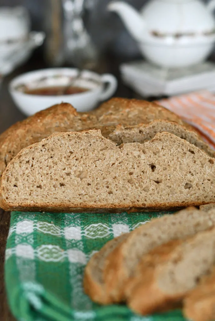 a slice of irish brown bread on a green towel