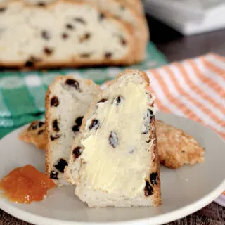 a slice of irish soda bread with butter and marmalade