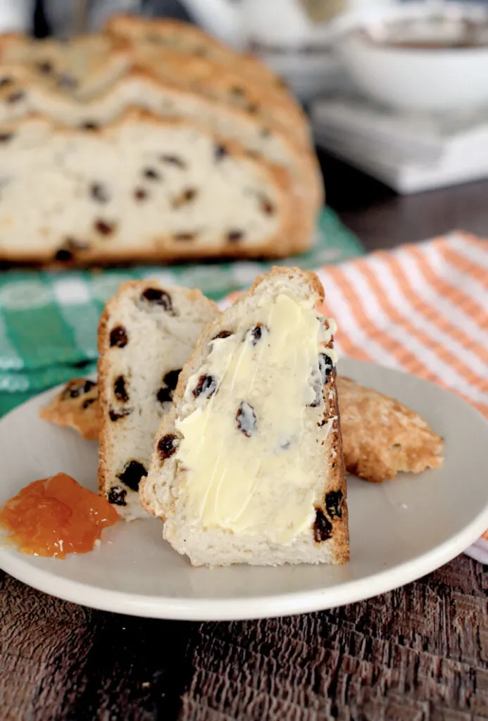 a slice of sourdough soda bread with butter and marmalade