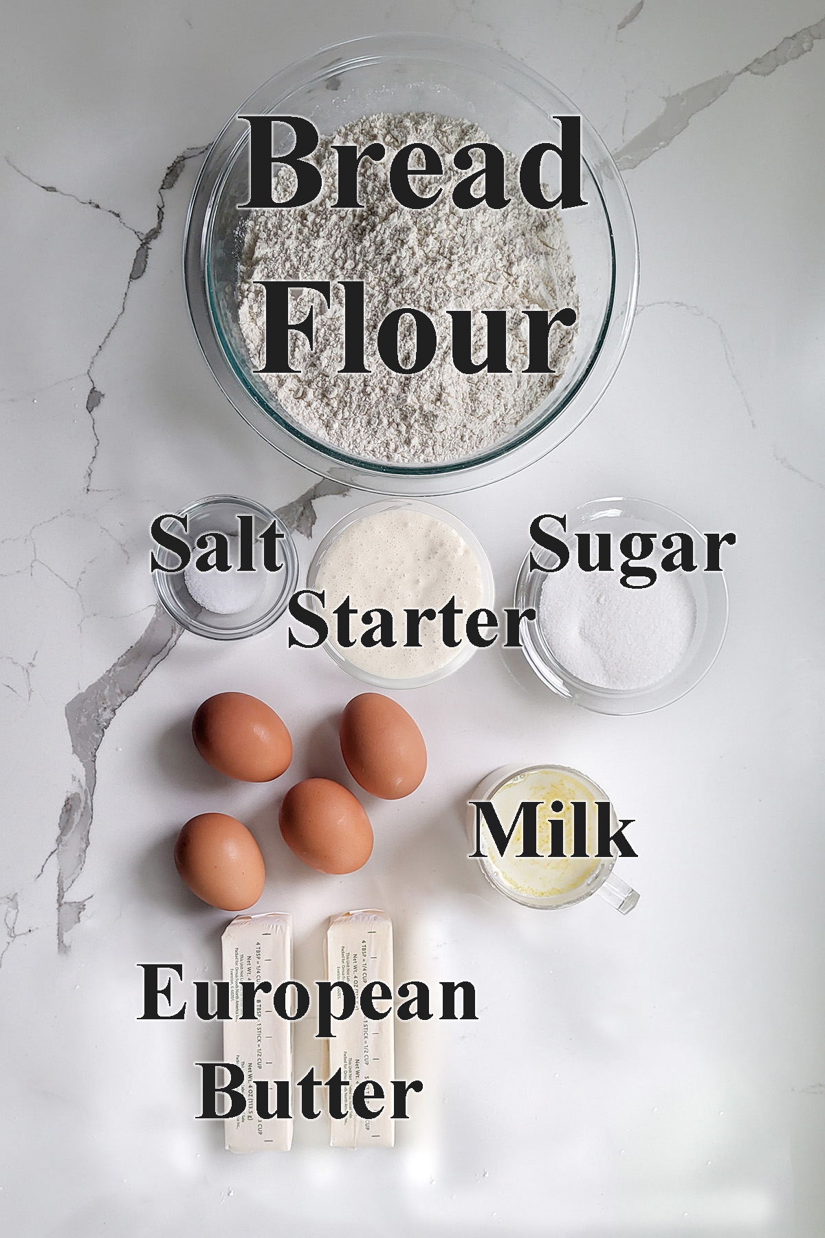 ingredients for sourdough brioche in glass bowls.