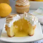 a pinterest image for lemon meringue cupcakes with text overlay