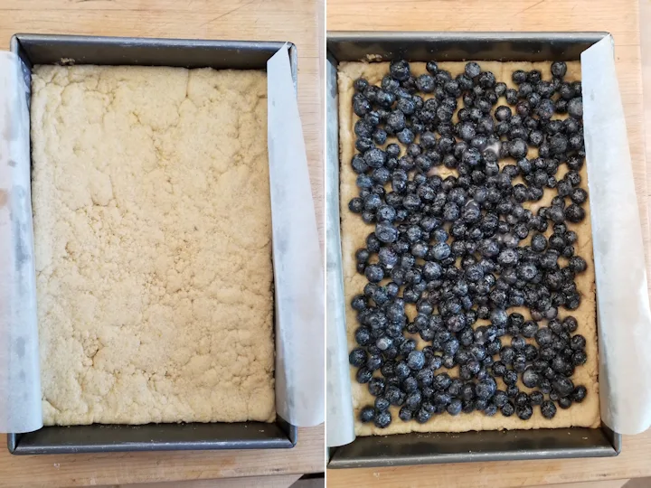 a baking pan filled with cornmeal crust and blueberries