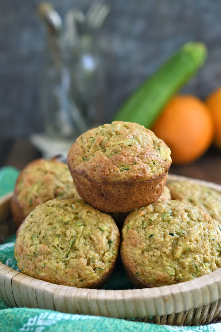 a basket of zucchini muffins