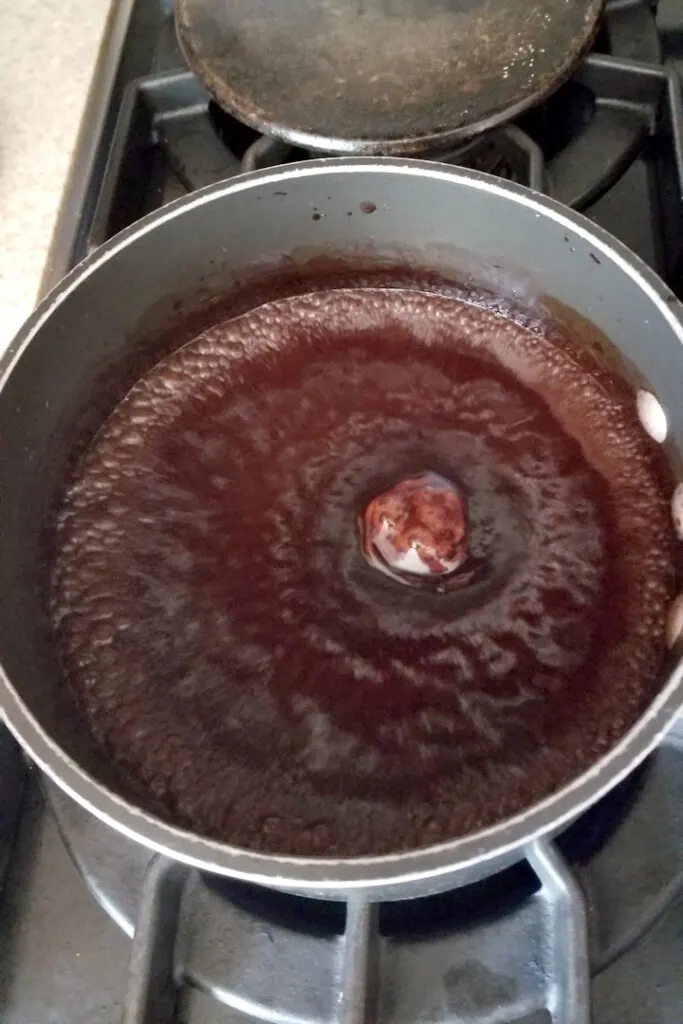 a pot of boiling chocolate syrup