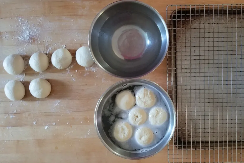 showing the setup for dipping pretzel roll dough