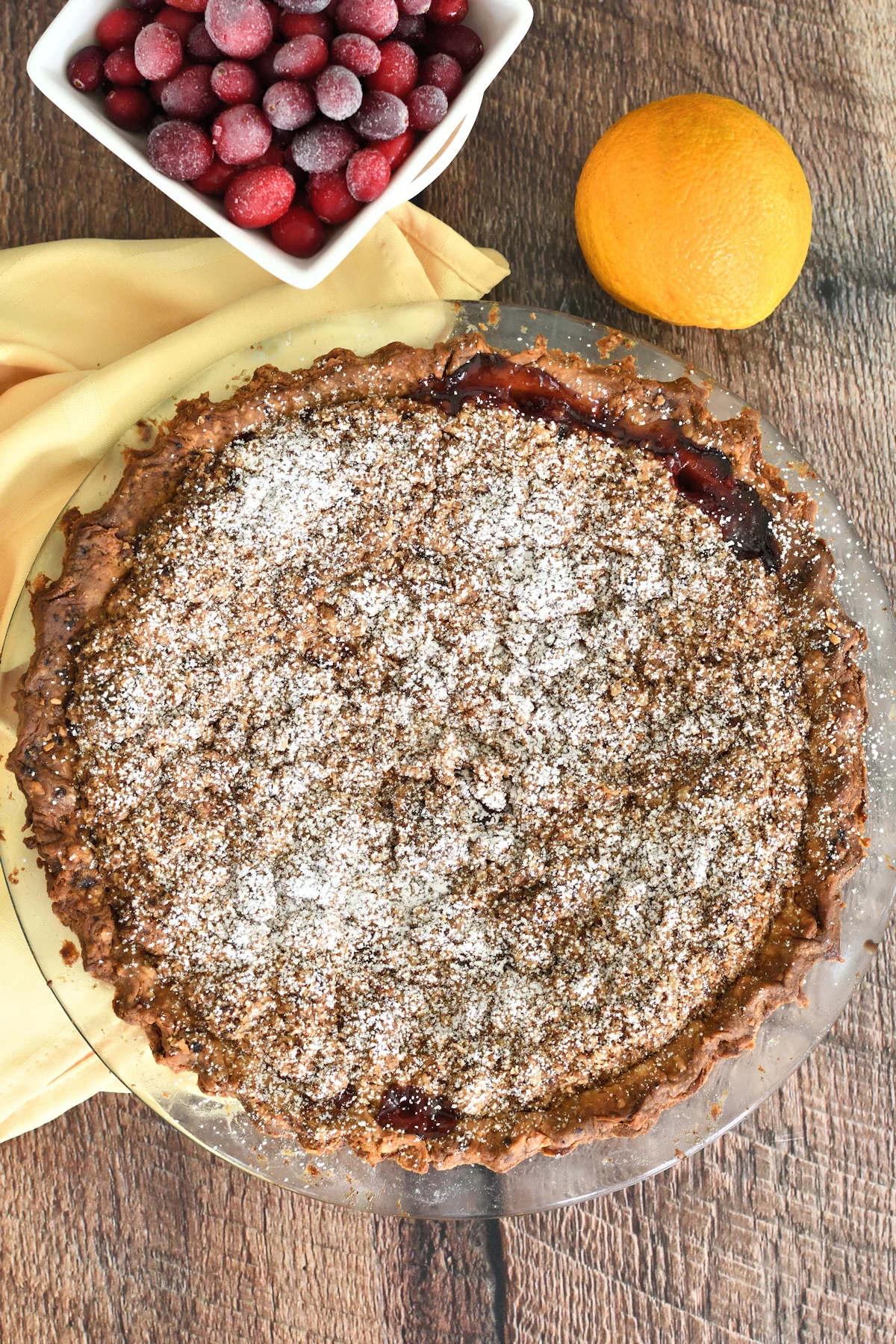 a crumb pie on a wood table.