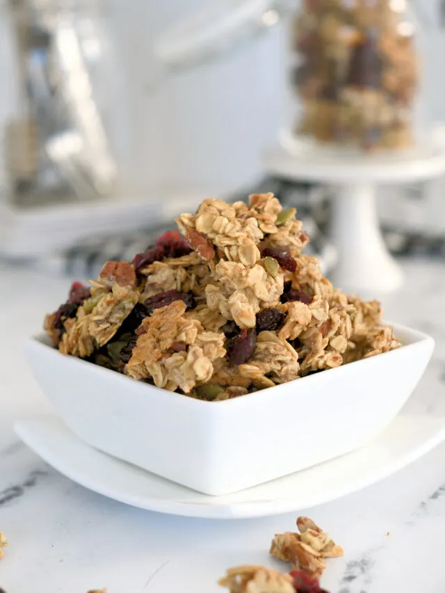 a white bowl filled with sourdough granola.