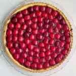 a pinterest image for chocolate cherry cheesecake tart with text overlay