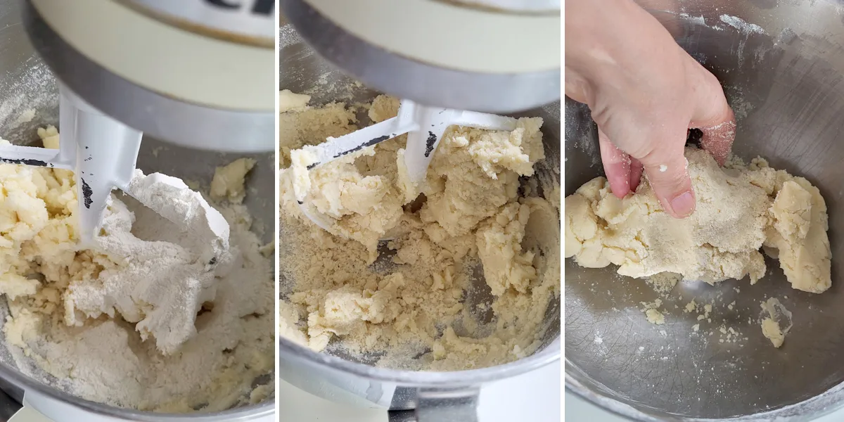 Flour added to shortbread dough. Flour mixed into dough. A hand knead bits of flour into shortbread dough.
