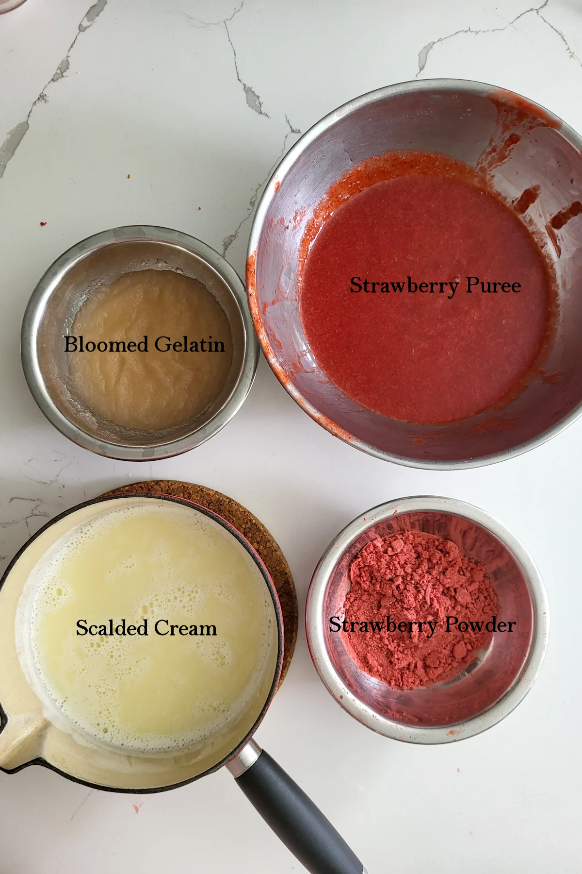 bowls of bloomed gelatin, strawberry puree, scalded cream and strawberry powder.
