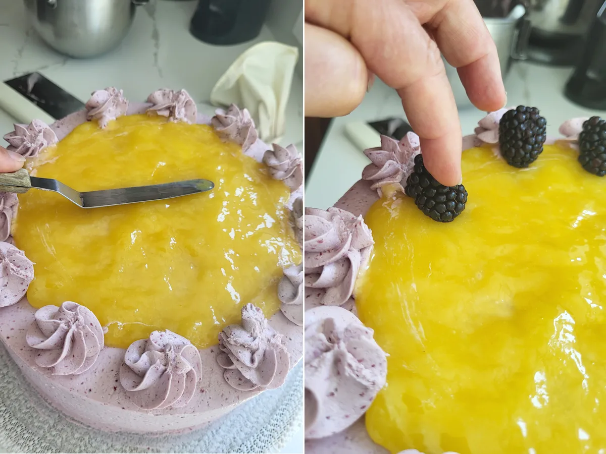 spreading lemon curd on a cake and placing blackberries on the cake