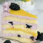 a pinterest image for blackberry lemon cake with text overlay