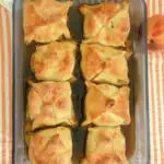 a pinterest image for peach dumplings with text overlay