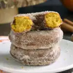 a pinterest image for pumpkin donuts with text overlay