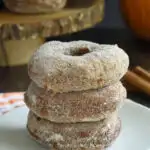 a pinterest image for pumpkin donuts with text overlay