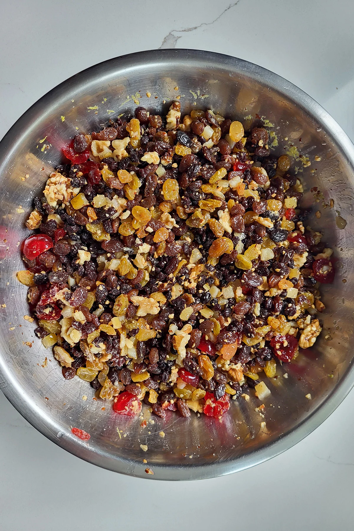 a bowl of mixed dried fruits and nuts.