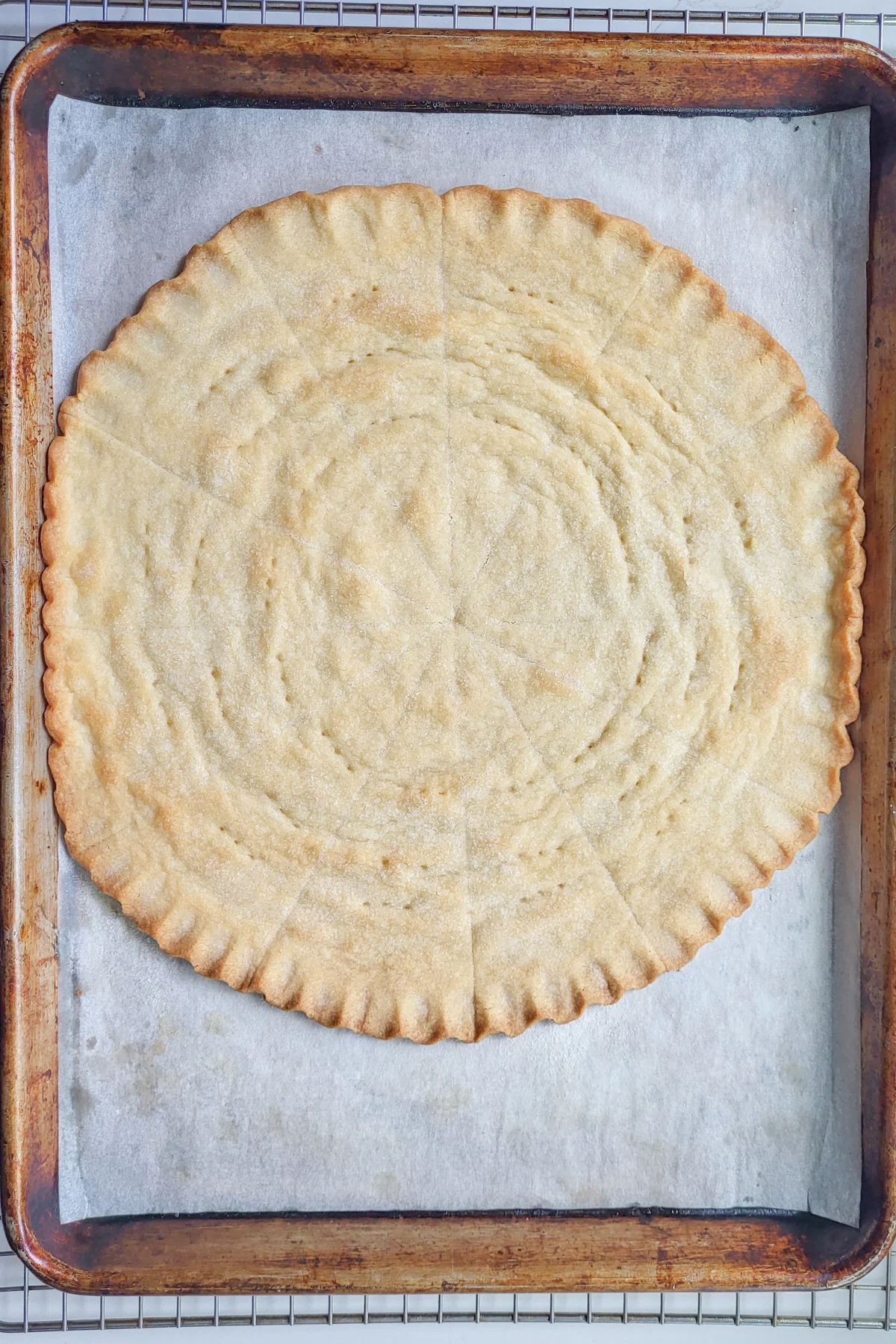 a round of baked shortbread on a tray