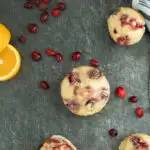 A pinterest image for cranberry muffins with text overlay