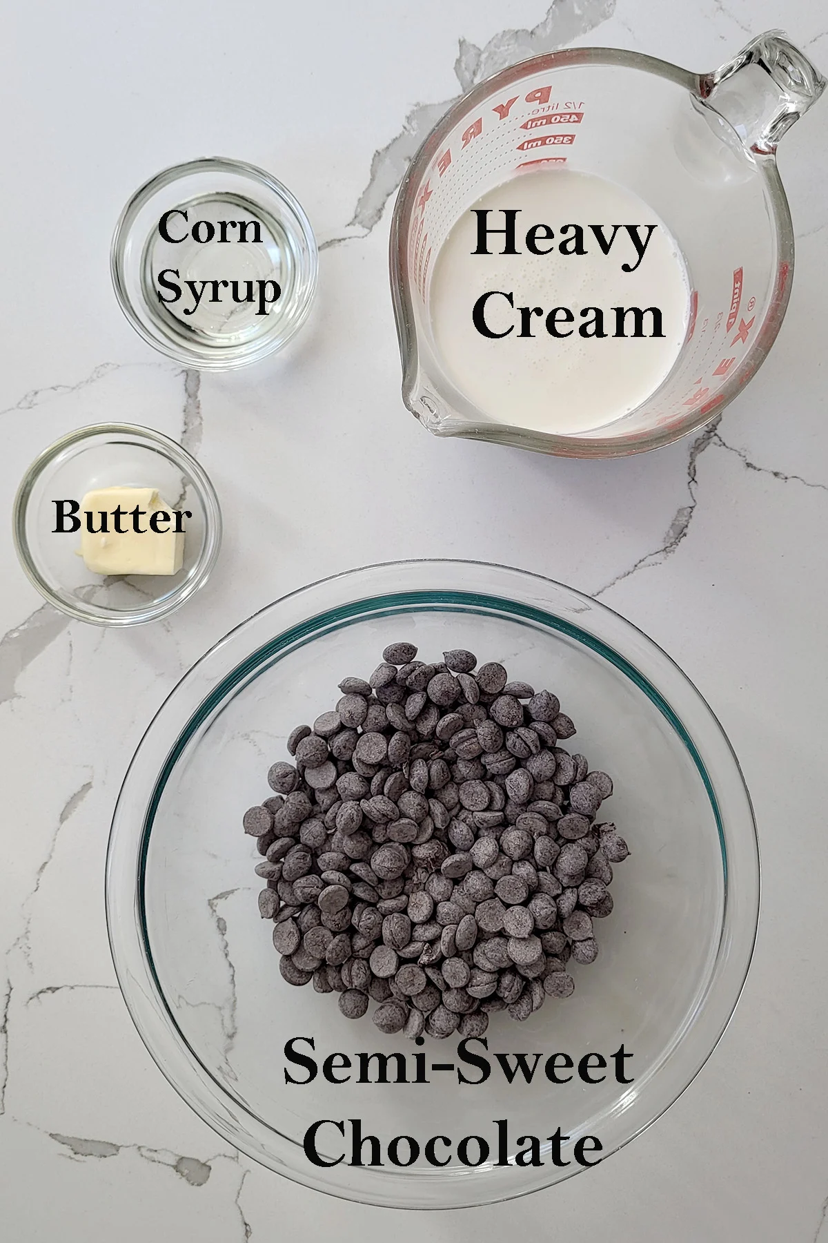 ingredients for making chocolate ganache in bowls with text overlay.
