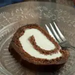 Pinterest image for chocolate swiss roll cake with text overlay