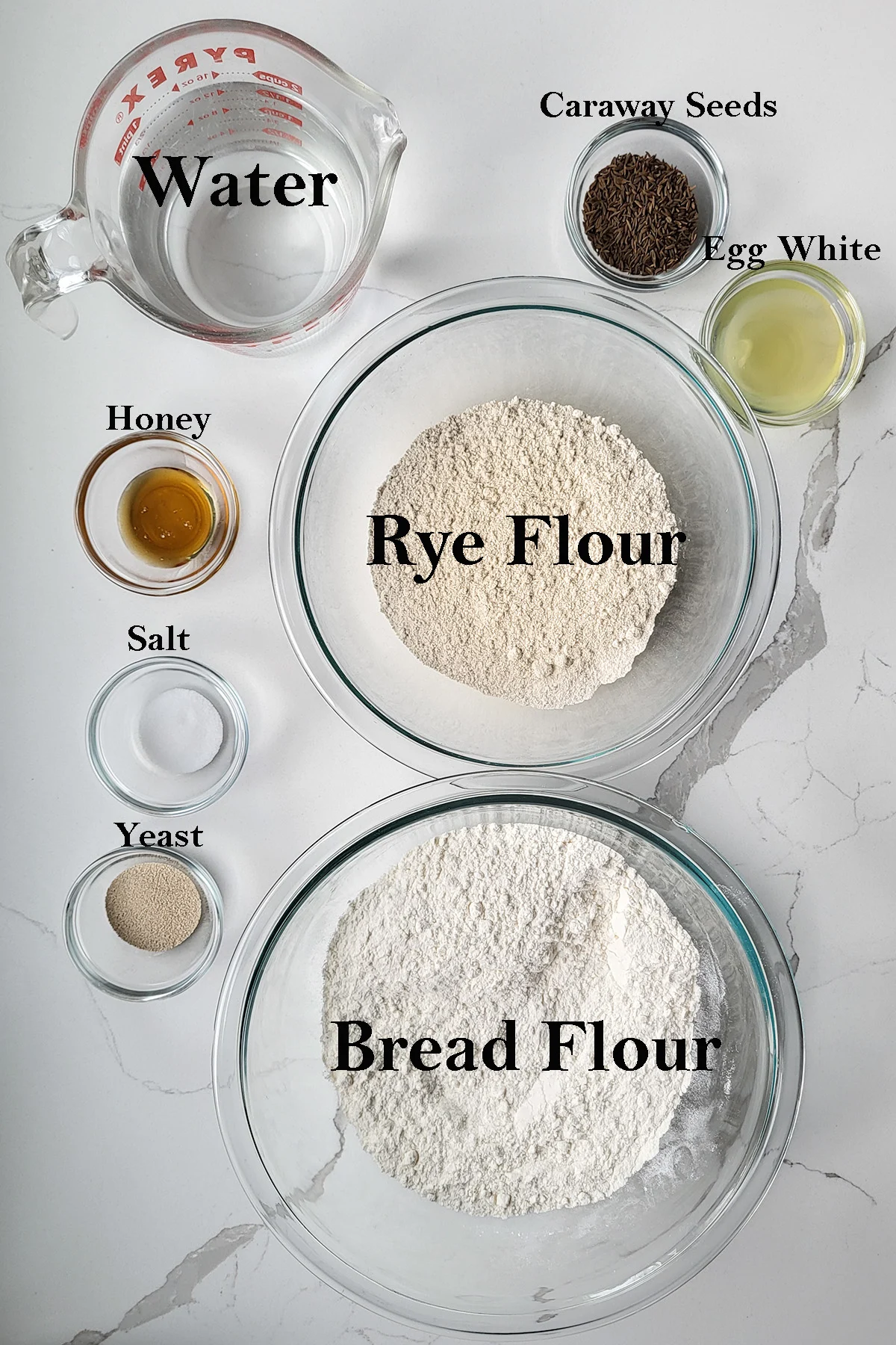 Ingredients for homemade rye bread in bowls