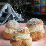 a pinterest image for cream puffs with text overlay