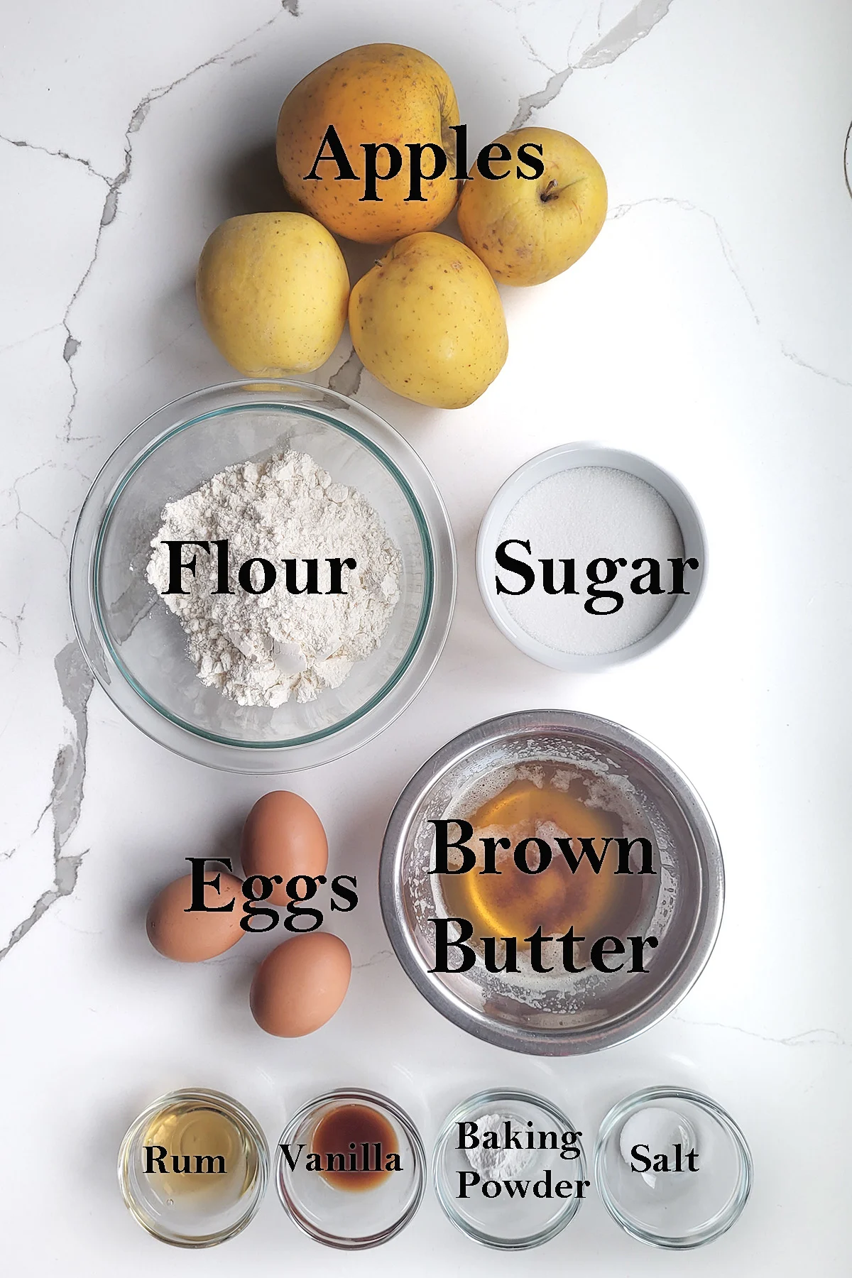 ingredients for french apples cake in bowls.