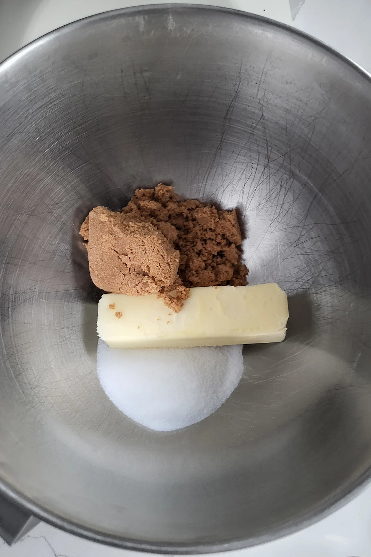 butter sugar and brown sugar in a bowl.