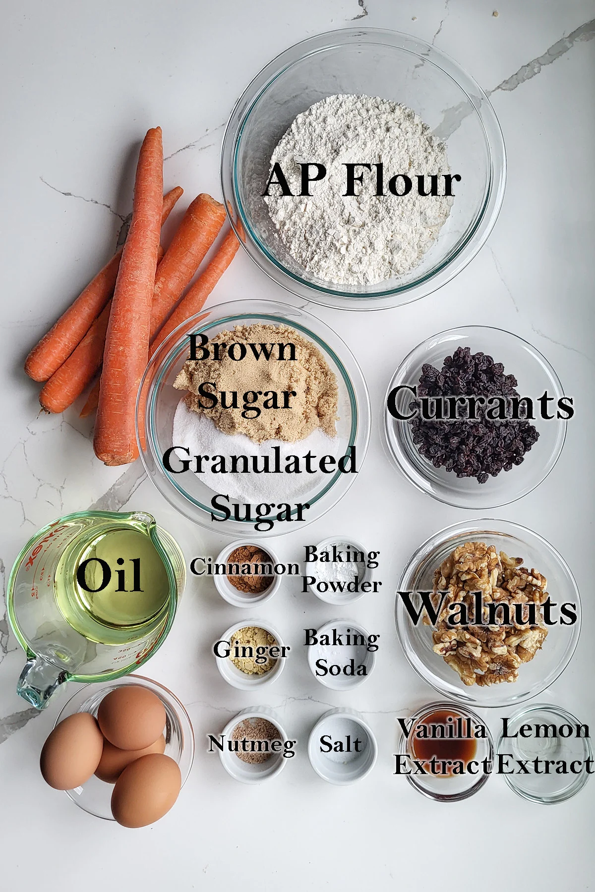 ingredients for carrot cake in bowls