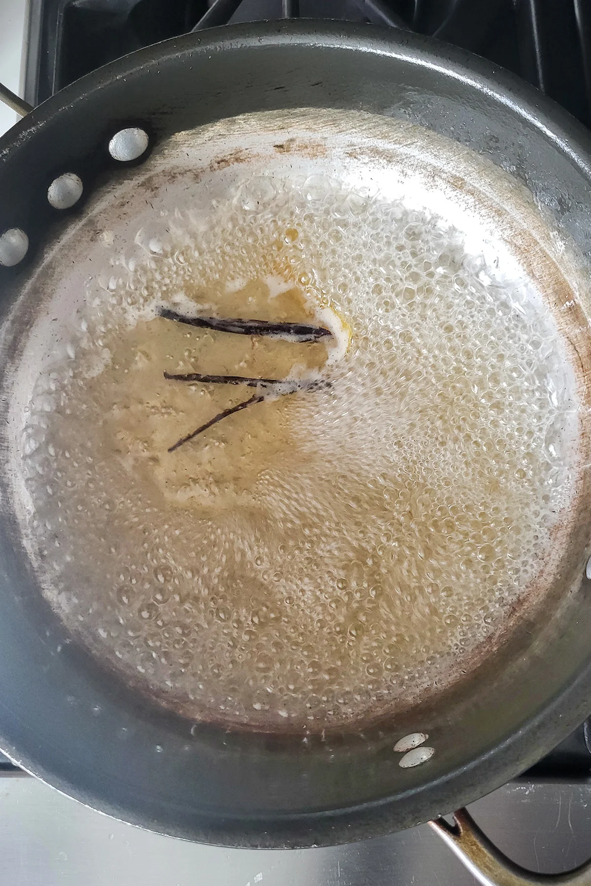 A pot of boiling sugar syrup.