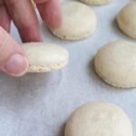 a pinterest image for macaron techniques with text overlay.