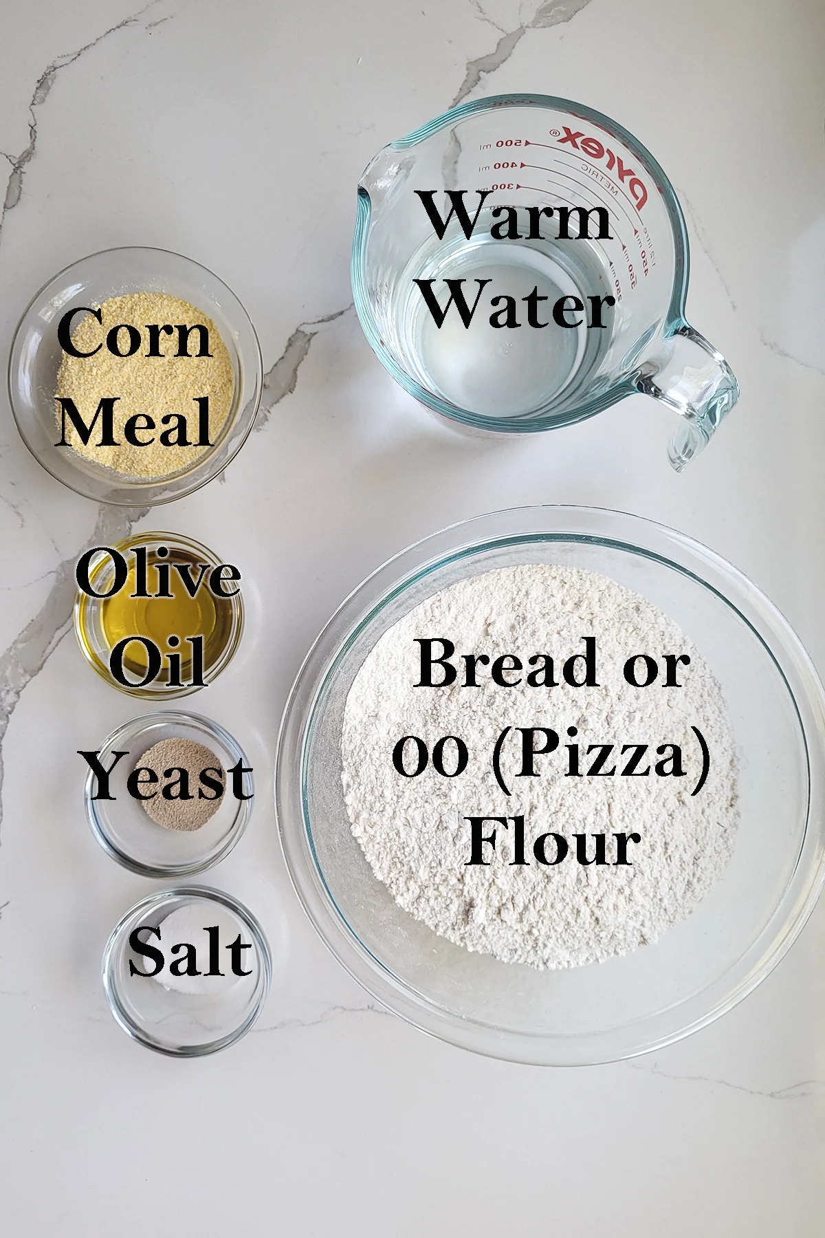 ingredients for pizza dough in bowls on a white surface.