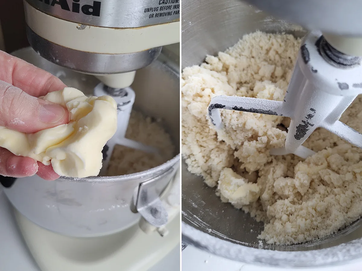 a stand mixer bowl with flour. A hand tossing in butter.