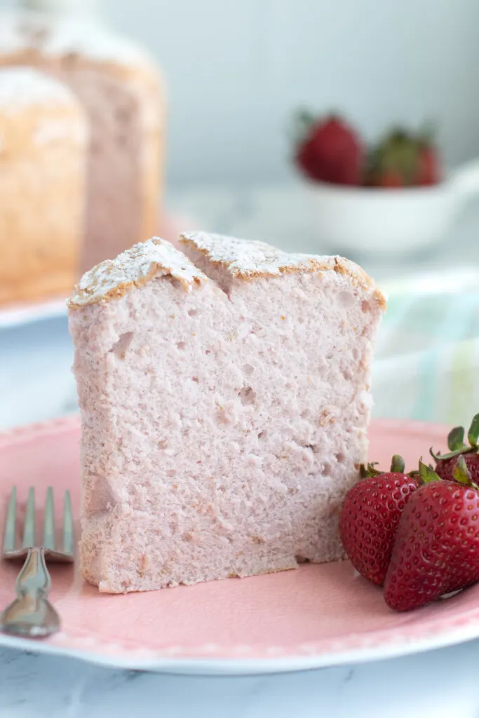 beauty shot slice of strawberry angel food cake on a plate.