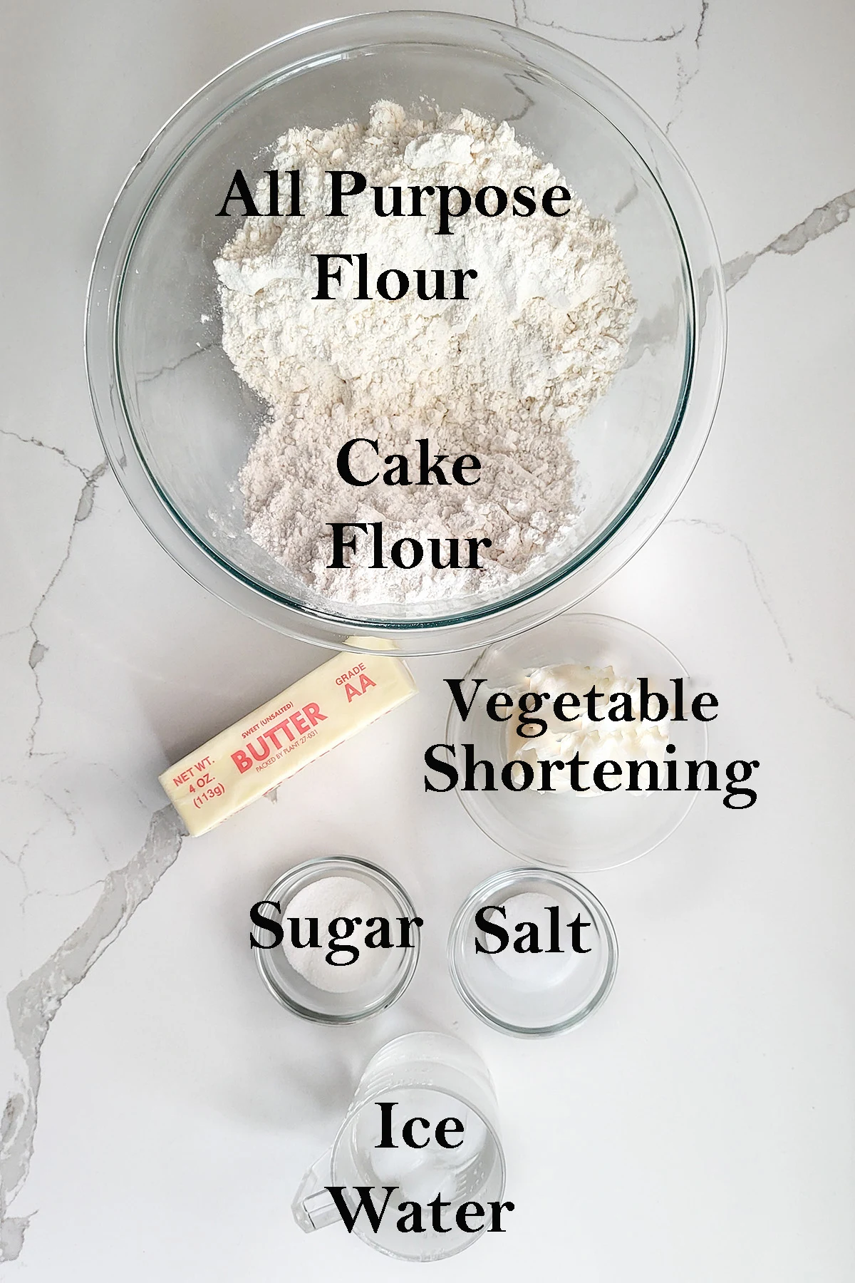 ingredients for homemade pie crust in bowls.