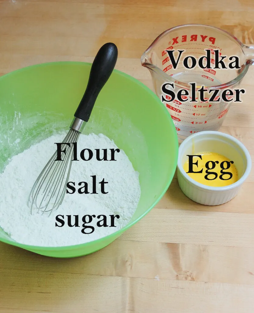 Ingredients for tempura batter in bowls.