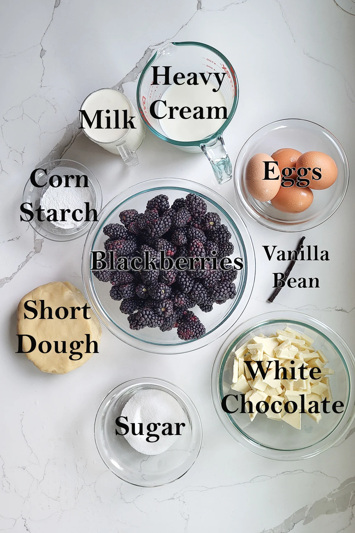 Ingredients for blackberry tart in bowls.