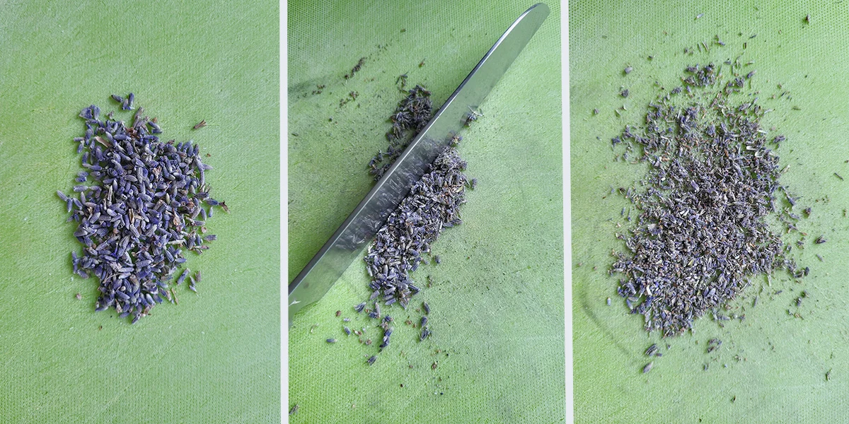 lavender blossoms on a green cutting board cut with a knife.