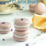 a pinterest image for lavender macarons with text overlay.