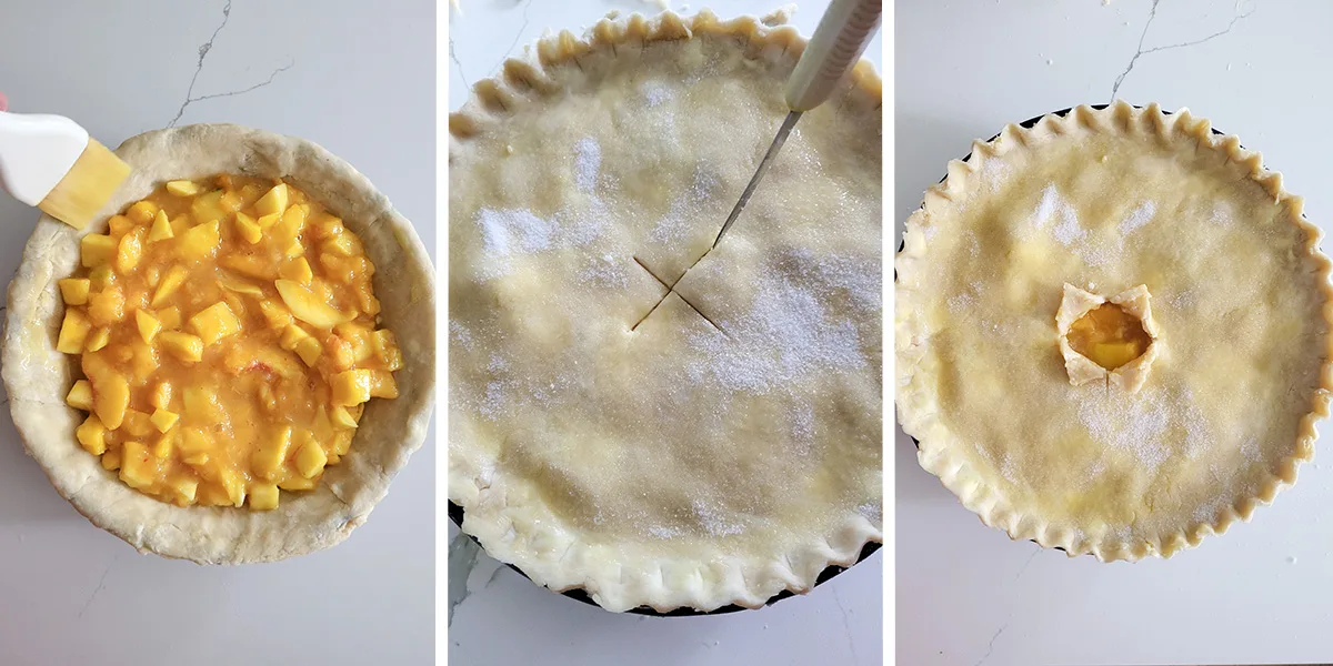 A pie shell filled with peaches and mangos. A pie ready to be baked.