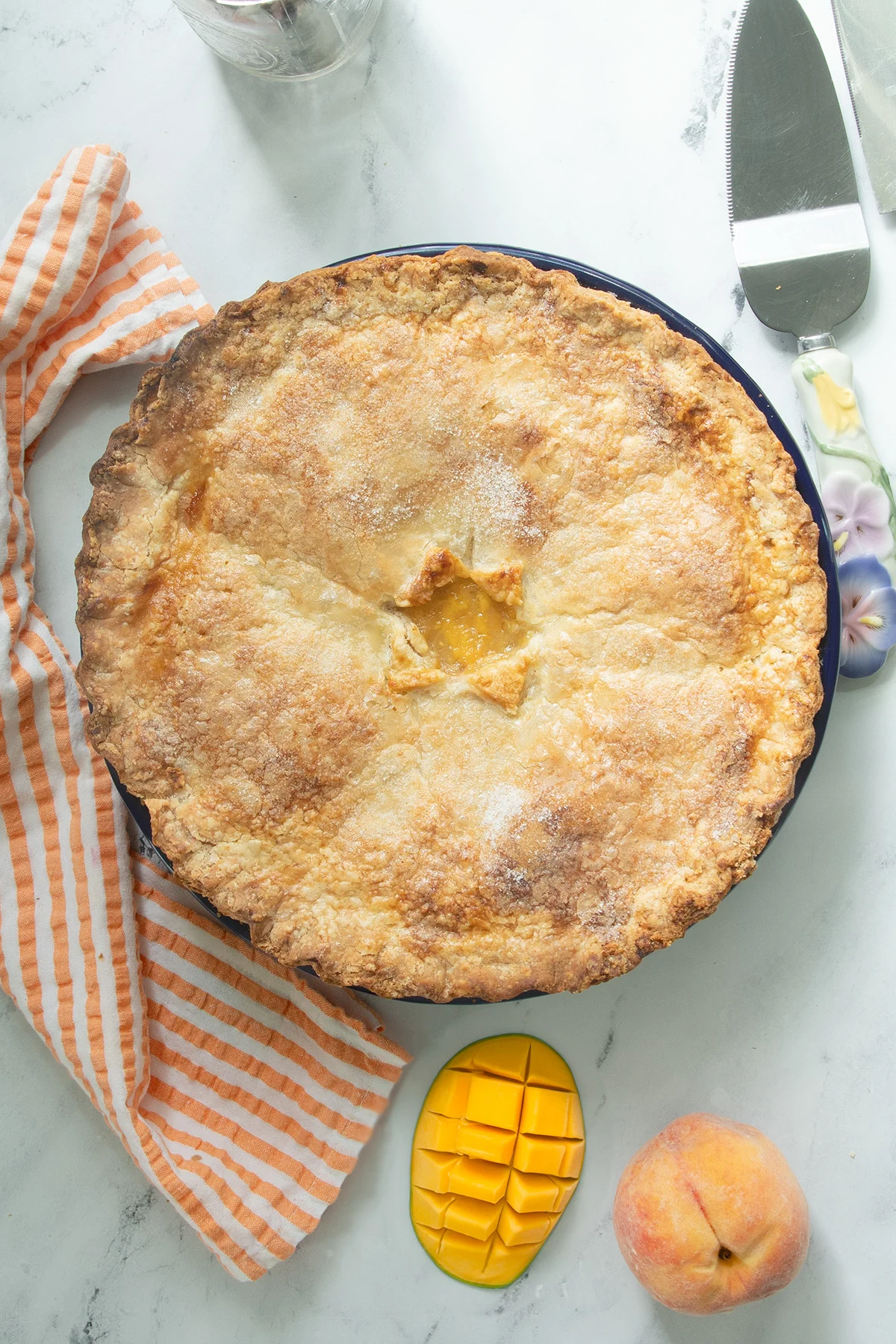 overhead shot of a peach mango pie.