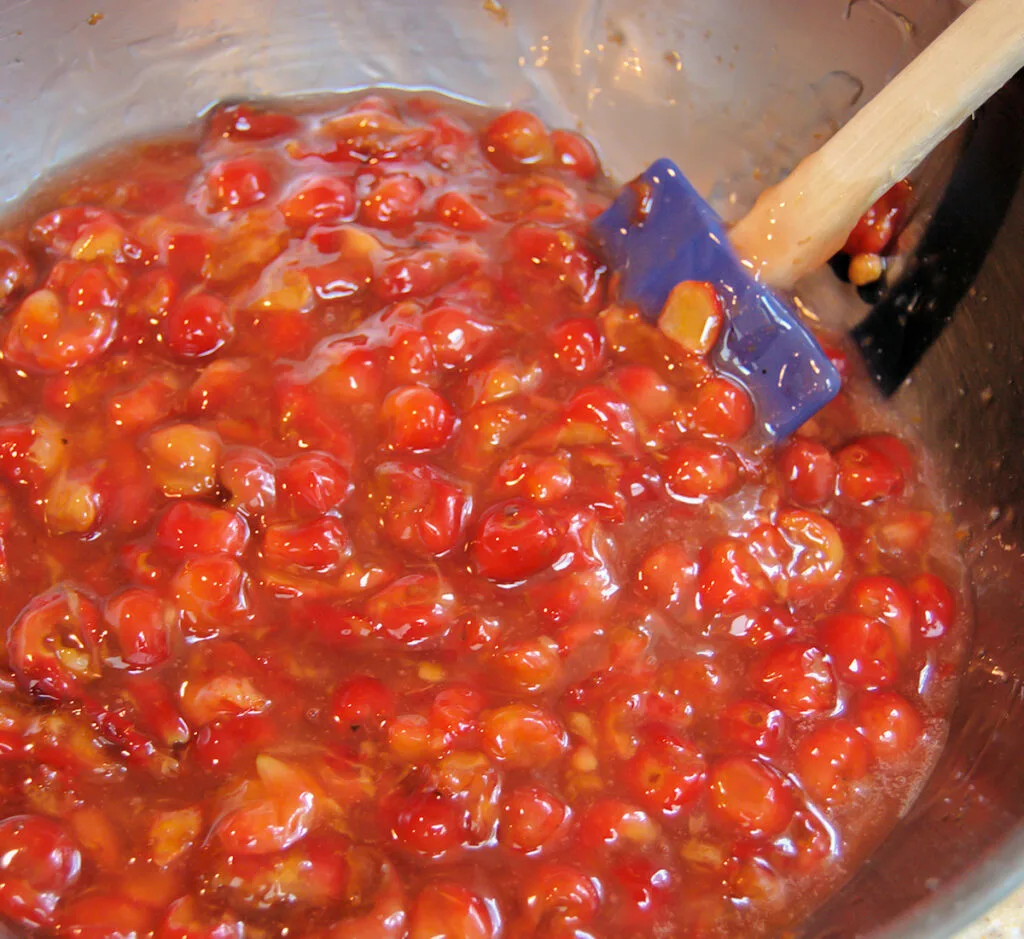 A bowl of sour cherry pie filling.