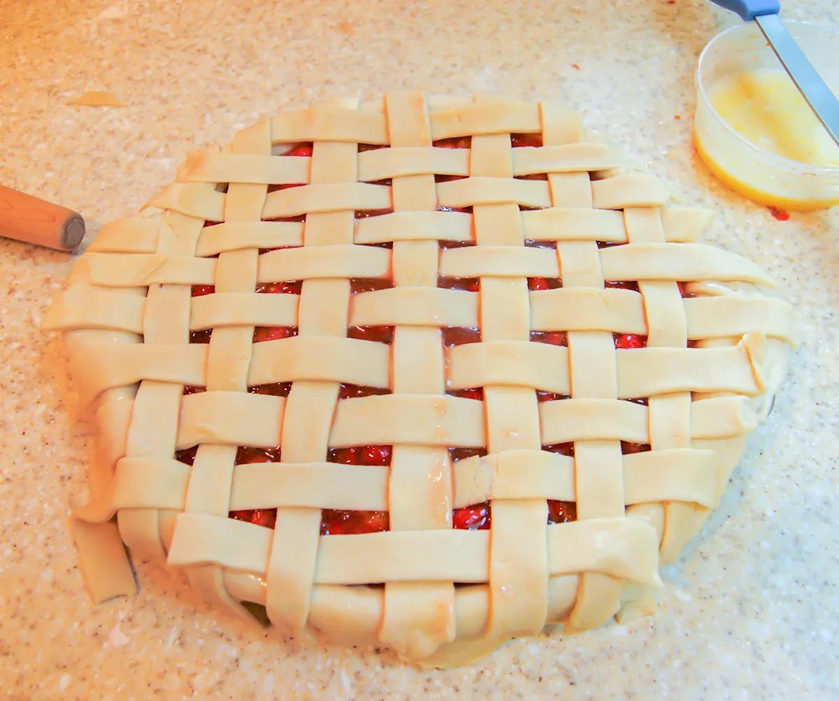 An unbaked lattice top cherry pie