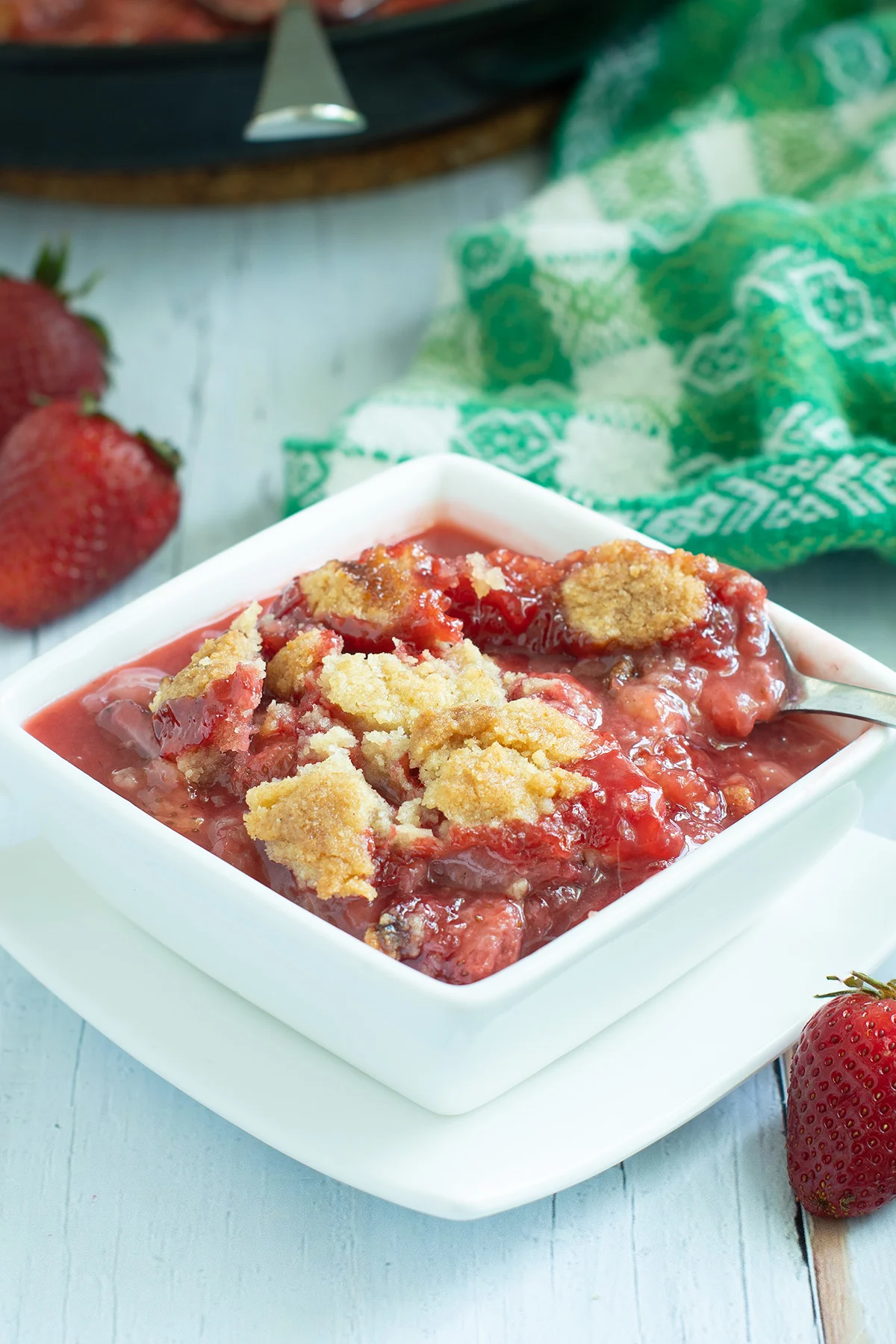 A bowl of strawberry crumble.